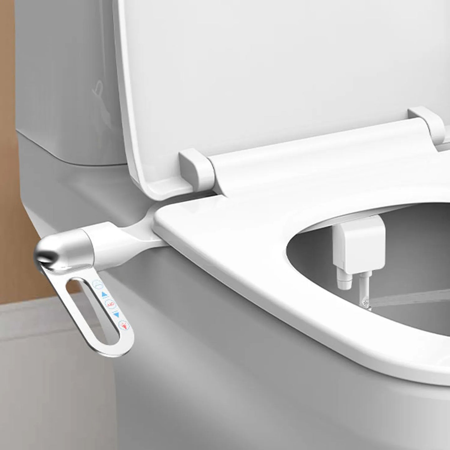 Close-up of a modern toilet seat with a bidet attachment on a neutral background