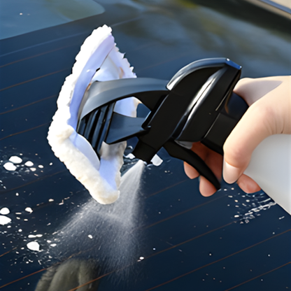 Beelines Window Vacuum step 1 - spray detergent from built-in spray bottle onto glass surface