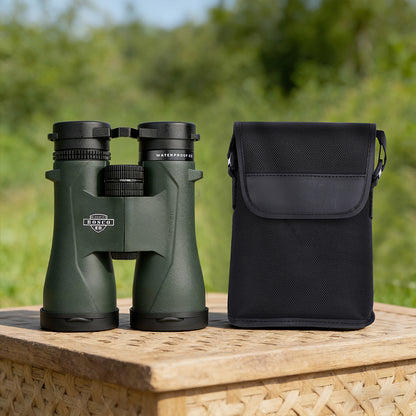 Green Bosco Apex HD-X1 Binoculars with a black carrying case on a wooden surface outdoors.