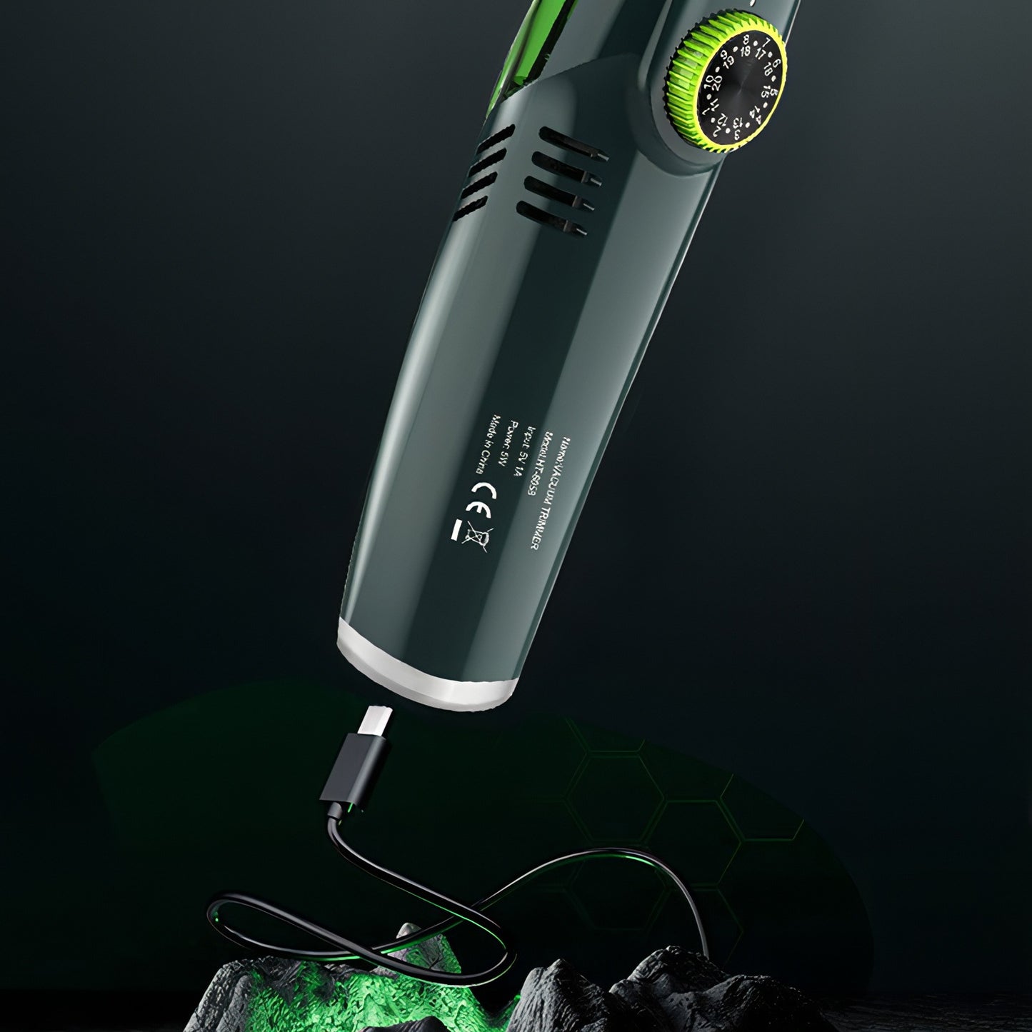 Green and black Bytech Beard Trimmer device with a cord on a dark background