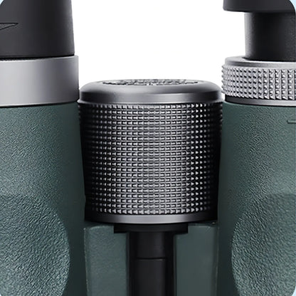 Close-up of a green and black Bytech Binoculars with a textured cylindrical component.