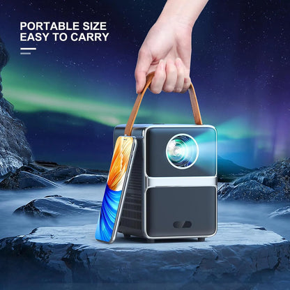 Bytech Full HD Portable Smart Projector held by a hand with a snowy landscape and northern lights in the background