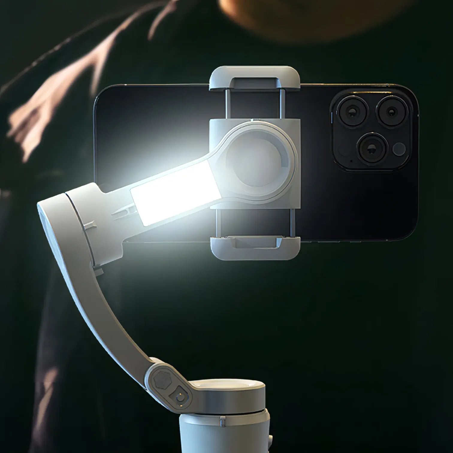 Smartphone with a mounted light and Bytech Gimbal on a dark background