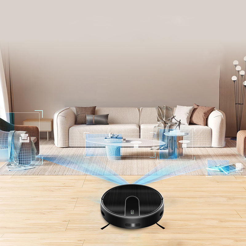 A black Bytech Robot Vacuum Cleaner sits on a light wood floor in a modern living room, with blue laser projection lines sweeping across the room toward a sofa and side tables, suggesting a smart home environment.