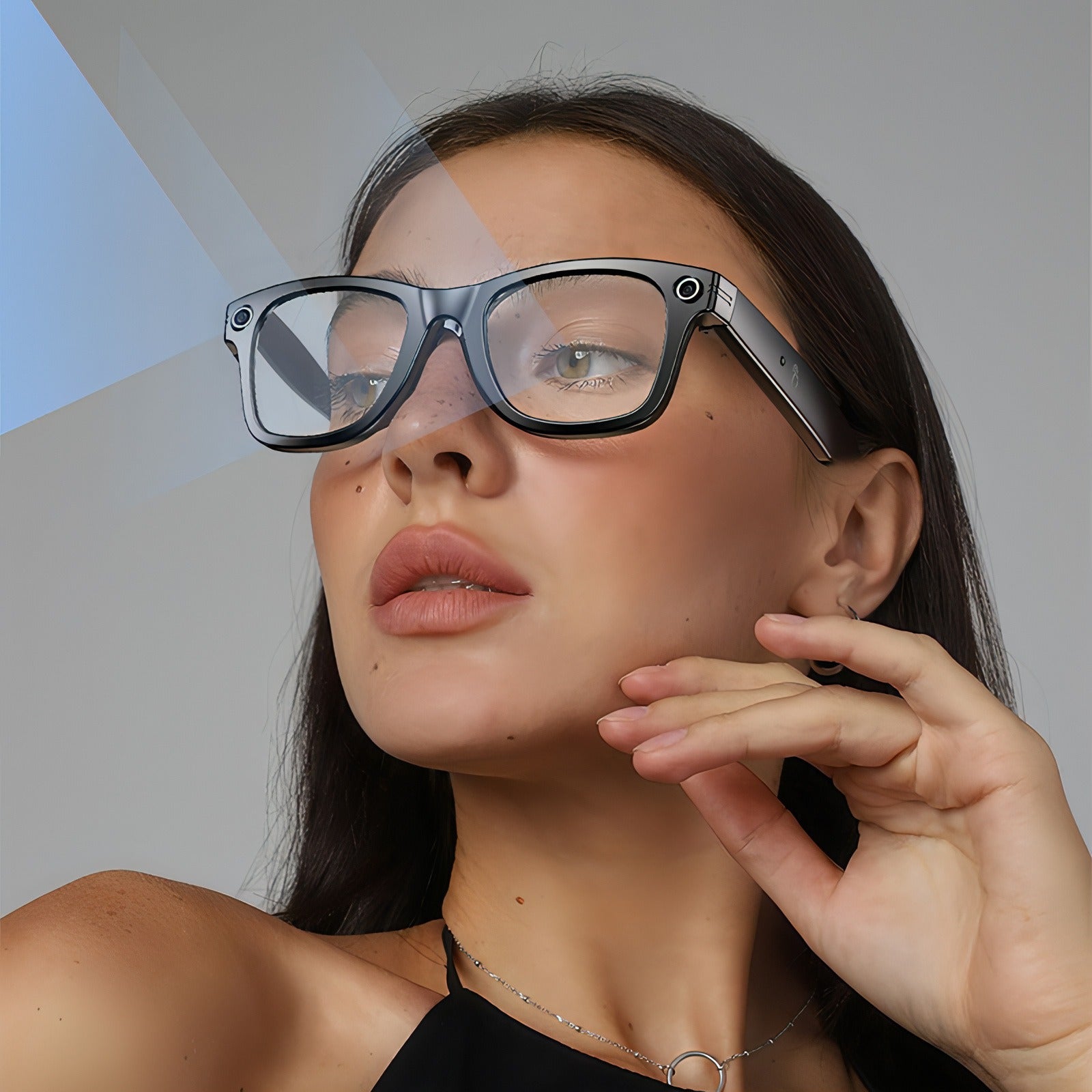 Woman wearing futuristic Bytech Smart Glasses with a neutral background