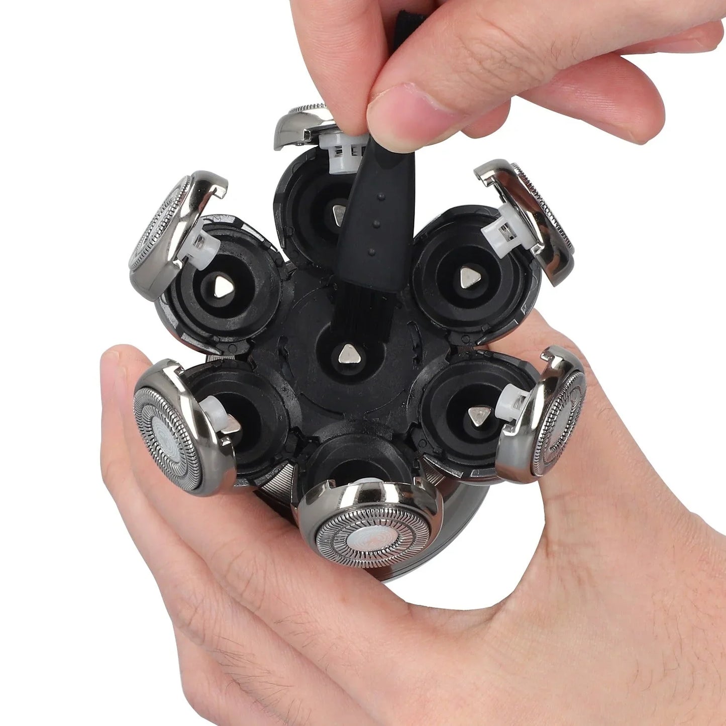 Multiple Calthic Shaving head held in a hand against a white background