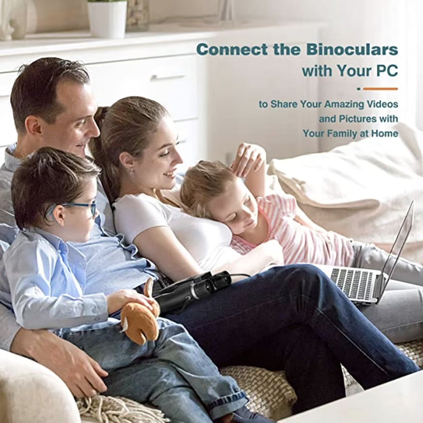 Family sitting on a couch with a laptop, using ClaroVis Binoculars to connect with their PC.