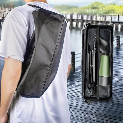 Person wearing a black crossbody bag with a green water bottle and black umbrella on a dock.