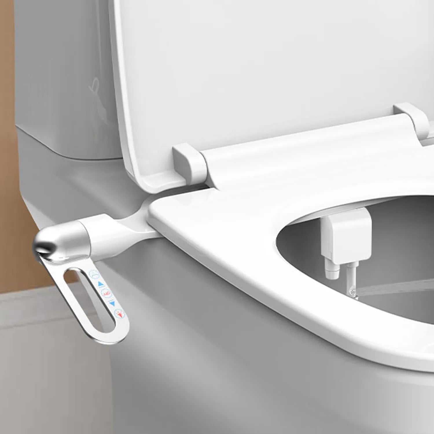 Close-up of a modern toilet seat with a bidet attachment on a neutral background
