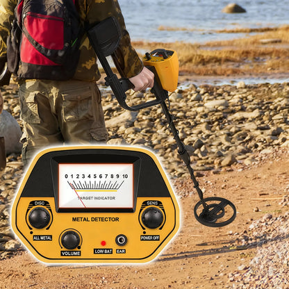 Person using a Sonora Metal Detector on a rocky beach