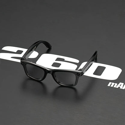 Black glasses on a dark background with '260' and 'mAM' text.