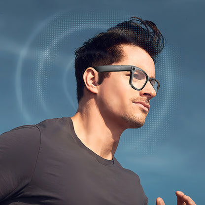 Man wearing futuristic Bytech Smart Glasses against a blue background
