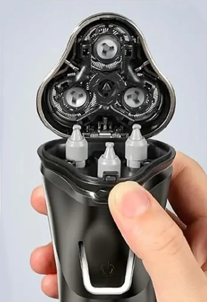 Bytech Electric Shaver head with three circular components held by a hand against a light gray background